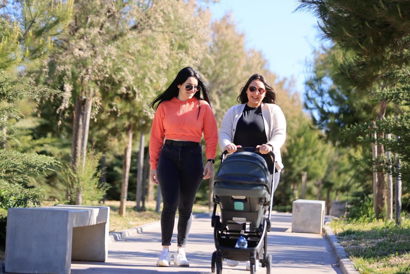 Two women walking with a stroller